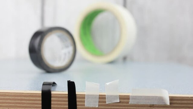 Parts of tape. Glue pieces of adhesive tape. Paper tape. Insulating tape.