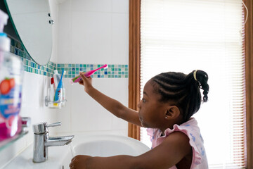 Girl brushing teeth