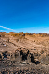 Cover page with Icelandic landscape of colorful volcanic caldera Askja, in the middle of volcanic desert in Highlands, with red, turquoise volcano soil and blue sky, Dreki trail, Iceland.