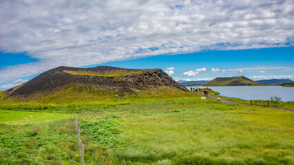 Fototapeta na wymiar Pseudo craters, volcanoes and geothermal areas near Skutustadir and lake Myvatn in Iceland, summer with blue sky at sunny day.
