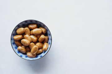  caramel chocolate bar in a bowl on white 