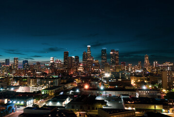 Naklejka na ściany i meble Los Angeles downtown buildings at night. Los Angeles drone view of downtown skyline. 