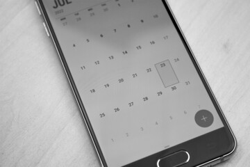 Calendar on a smartphone.Scheduling dates.Label on a calendar on a smartphone.
