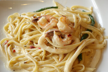 plate of sea food pasta on table 