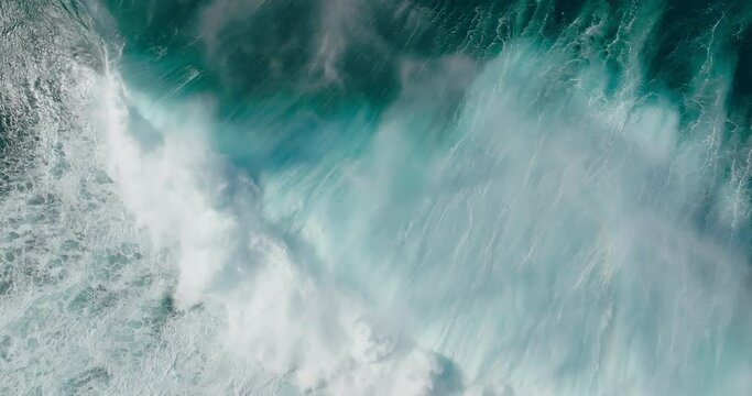 Top down view of giant ocean wave crashing