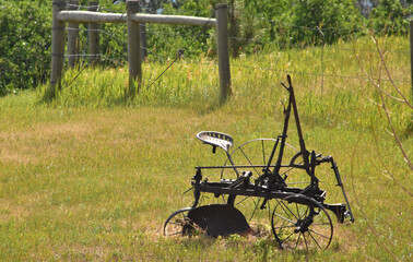 Rusty Old Plough in a Field in the Midwest