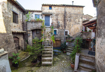 Fototapeta na wymiar Calcata (Viterbo, Italy) - The old town of Calcata, perched on a mountain of tufa, overlooking the green Treja river valley, in Lazio region.