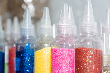 Glitter in plastic bottles. Decorative sequins to give shine, create festive atmosphere. - 503931404