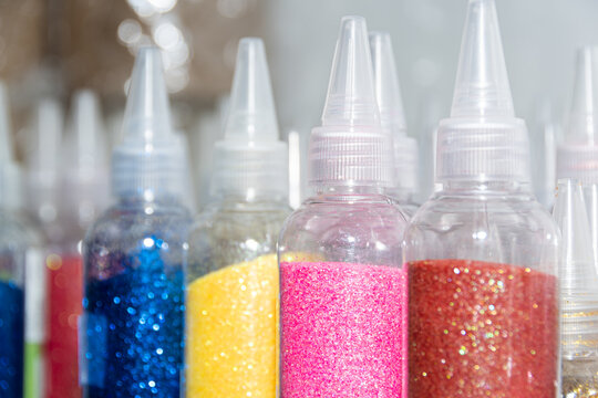 Glitter in plastic bottles. Decorative sequins to give shine, create festive atmosphere.