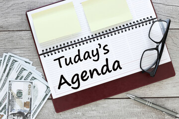 Today's Agenda text on planner page with glider near money