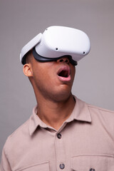 Man wearing virtual reality headset and looking up