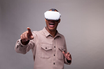 Man wearing virtual reality headset and gesturing