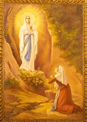 Tuinposter MONOPOLI, ITALY - MARCH 6, 2022: The painting of Appearance of Virgin Masry to st. Bernadette in Lourdes  in the church Chiesa di San Franceso d Assisi by A. Nicolas (1932). © Renáta Sedmáková