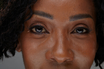 Studio portrait of mature woman, close up of eyes