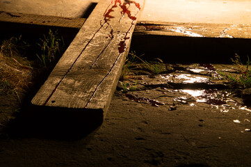 Blood drips on a wooden cross