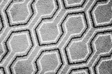 Arabic geometric carpet pattern, black and white lines over gray background