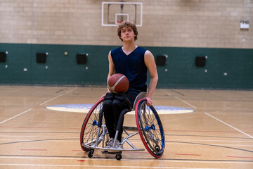 Portrait of male basketball player in wheelchair - obrazy, fototapety, plakaty