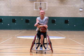 Portrait of male basketball player in wheelchair - obrazy, fototapety, plakaty