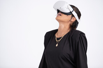 Studio shot of young woman wearing VR headset