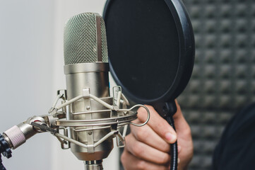 close up condenser microphone in professional studio.