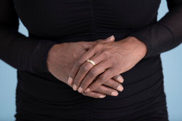 Close up of woman's hands with engagement ring