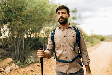Man hiking with backpack and trekking poles in Brazilian Caatinga