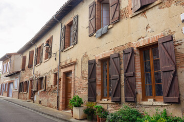 Fototapeta na wymiar Veiw at the medieval houses and a street in the in Rieux-Volvestre, Haute-Garonne, France