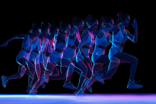 Development of movements. Professional female athlete, runner training isolated on dark background with stroboscope effect. - Powered by Adobe