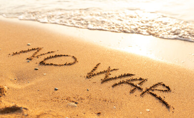 Words written in the sand on the beach. The words No War and written in the Sand with the Ocean in the background. Protest War sign written in sand. World Peace. No War