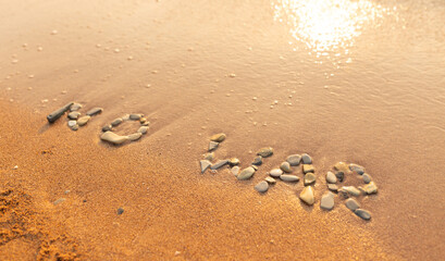 Words written in the sand on the beach. The words No War and written in the Sand with the Ocean in the background. Protest War sign written in sand. World Peace. No War