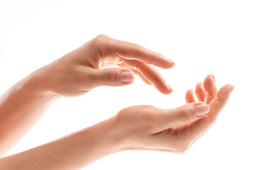 Fototapeta na wymiar Female hands with soft skin and beautiful french manicure on white background