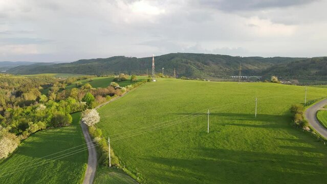 Beautiful 4k drone footage of meadow in Czechia. Fields and meadow with sunset
