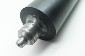 Used rubber-coated printing machine roller to roll out the ink when printing on flexographic paper....
