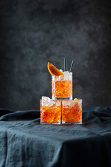 Italian traditional cocktail Aperol Spritz with orange