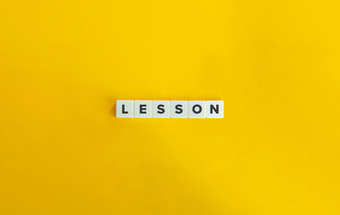 Lesson Word and Banner. Letter Tiles on Yellow Background. Minimal Aesthetics.