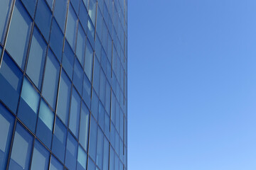 Fototapeta na wymiar Downtown corporate business district architecture. Glass reflective office buildings against blue sky and sun light. Economy, finances, business activity concept. Copy space.