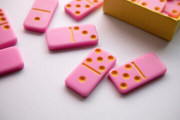 Children's toys. Pink domino for girls. Logic game for kids. Happy child and fun Games. High quality photo
