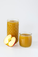 apple juice with pulp not filtered or clarified in a high glass and a slice of apple, space for text, banner