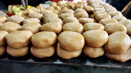 Row of indian sweets Peda.A Famous sweet desert in mathura in india - obrazy, fototapety, plakaty