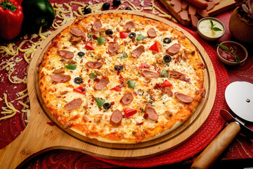 Sausage pizza with tomato sauce and mayo isolated on wooden board top view of italian food on wooden background