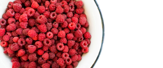 raspberry bowl full of fresh raspberries on white background