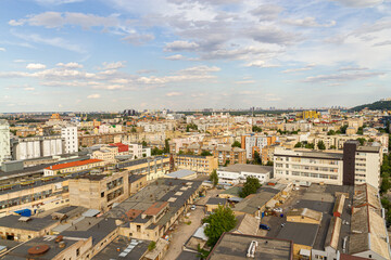 Kyiv, Ukraine – July 08, 2017: A beautiful panorama of Podil area. Aerial view on residential and industrial areas. A lot of buildings of different architectural style. Historical area, Dnipro river.