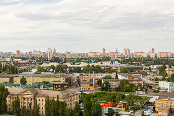 Kyiv, Ukraine – July 08, 2017: A beautiful panorama of Podil area. Aerial view on residential and industrial areas. A lot of buildings of different architectural style. Historical area, Dnipro river.
