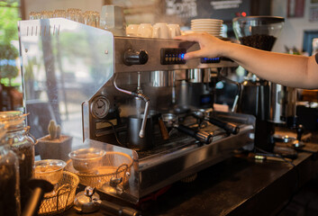 Coffee maker, portafilter with coffee, Useful as background for barista, bar, coffee shop.