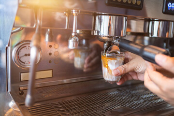 Coffee maker, portafilter with coffee, Useful as background for barista, bar, coffee shop.