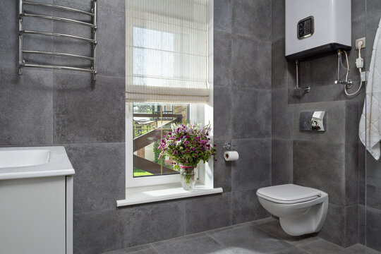 bathroom with gray tiles, bathroom with flowers, interior with bathroom