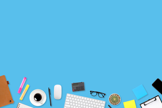 flat lay workspace table desk with laptop computer, office supplies, coffee cup, tablet and mobile smartphone on color background