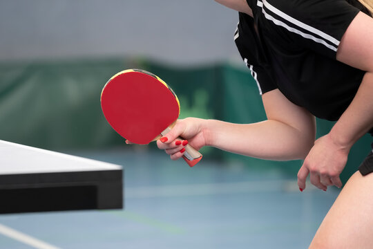close up of a female table tennis player waiting for the ball