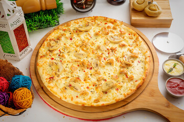 Pollo Alfredo pizza with tomato sauce and mayo isolated on wooden board top view of italian food on...