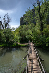 Fototapeta na wymiar wooden bridge over river